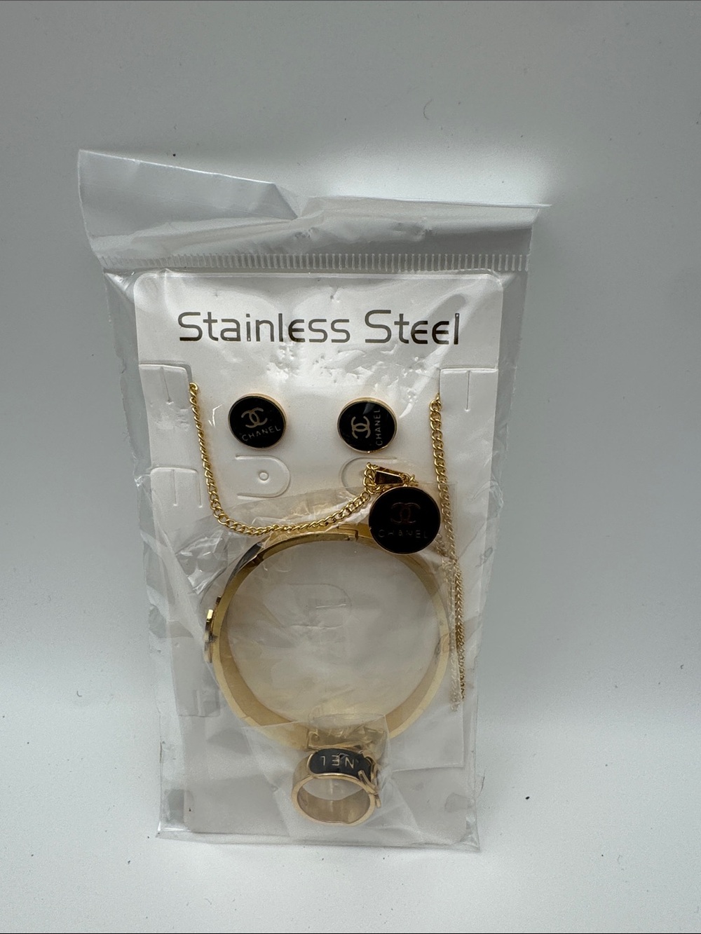 Gold and Black Stainless Steel Jewelry Set - Logo Accent